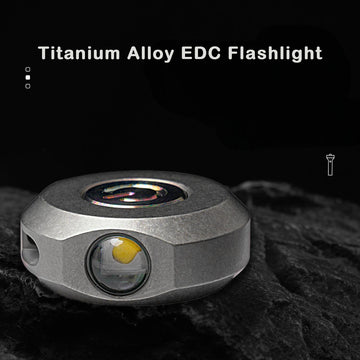 A compact titanium alloy LED flashlight with a sleek, modern design, featuring a dual-light configuration.